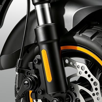 W9 Air's front wheel assembly with black suspension fork, ventilated disc brake, and rugged tire with orange rim accent. The design highlights shock absorption, safety, and precision engineering, ensuring a stable and comfortable ride.